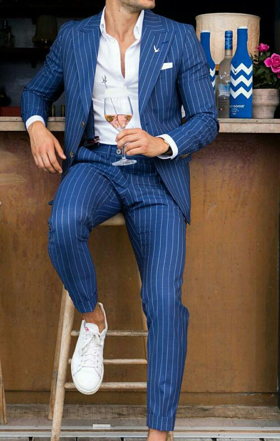 Blue striped suit with white shirt and white shoes